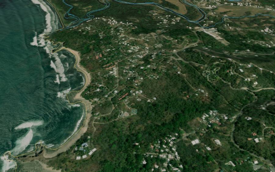 Vista del gemelo digital sobre Playa Pelada: la costa, los edificios detectados, los cauces y el límite de la zona marítimo terrestre